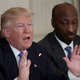 Merck & Company CEO Kenneth C. Frazier sits next to Donald Trump during a listening session with manufacturing CEOs in February 2017. Image via Getty.